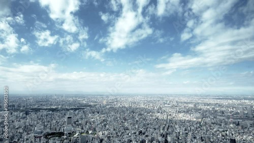 4K Tokyo skyline timelapse - cinematic urban aerial panorama. Scenic view - fast moving clouds over the city