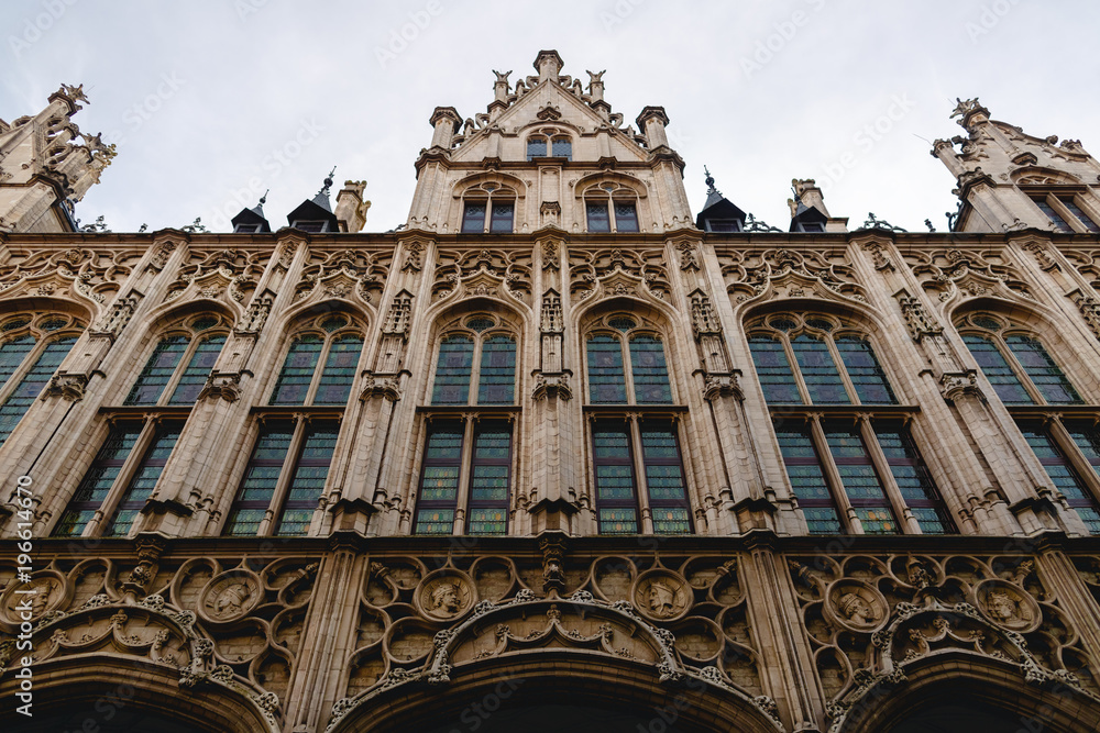 low angle view of beautiful old building with sculptures in mechelen, belgium
