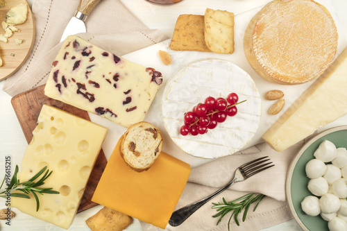 Various types of cheese on a light background