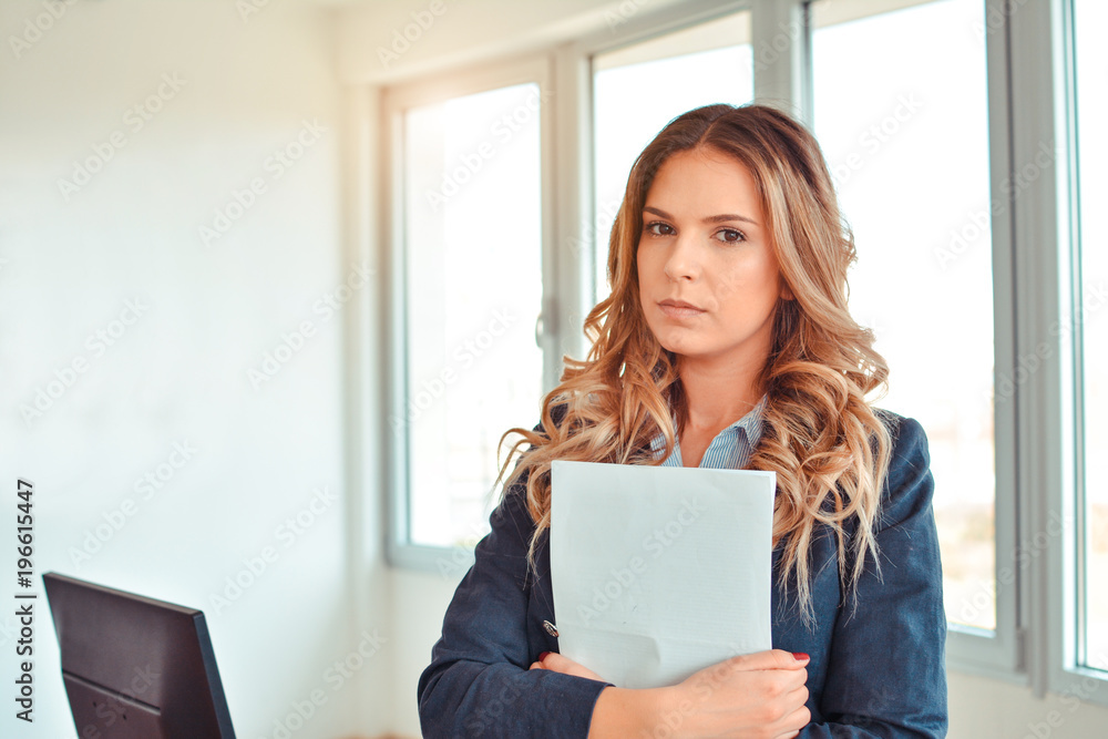Young confident business woman with documents Young confident business woman with documents