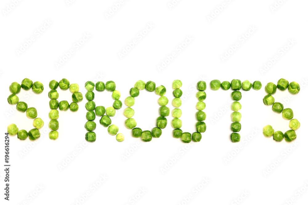 The word 'sprouts' is spelled out with brussel sprouts on a white Image and could be used to get across message of healthy eating, especially of green vegetables