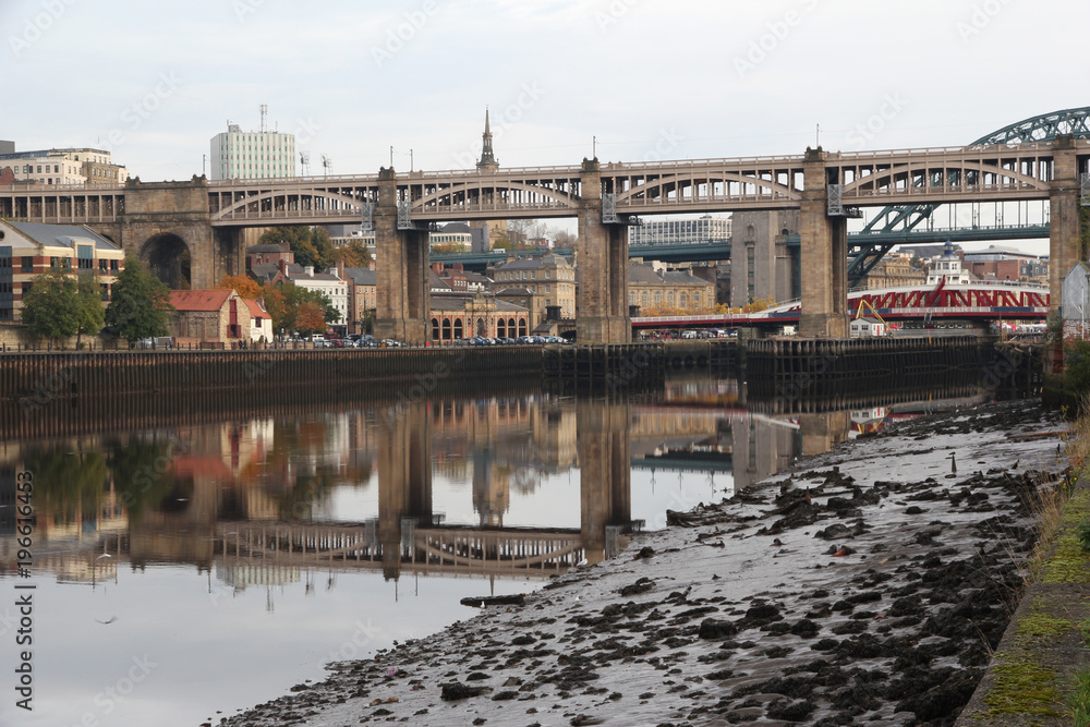 Newcastle-Upon-Tyne’s High Level Bridge showing a near perfect reflection in the River Tyne. Swing and Tyne bridge can also be seen in the background