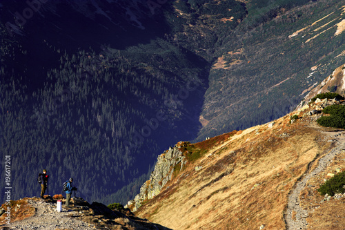 Poland, Tatra Mountains, Zakopane - ourists hiking over Silent Valley Path to Czerwone Wierchy peaks