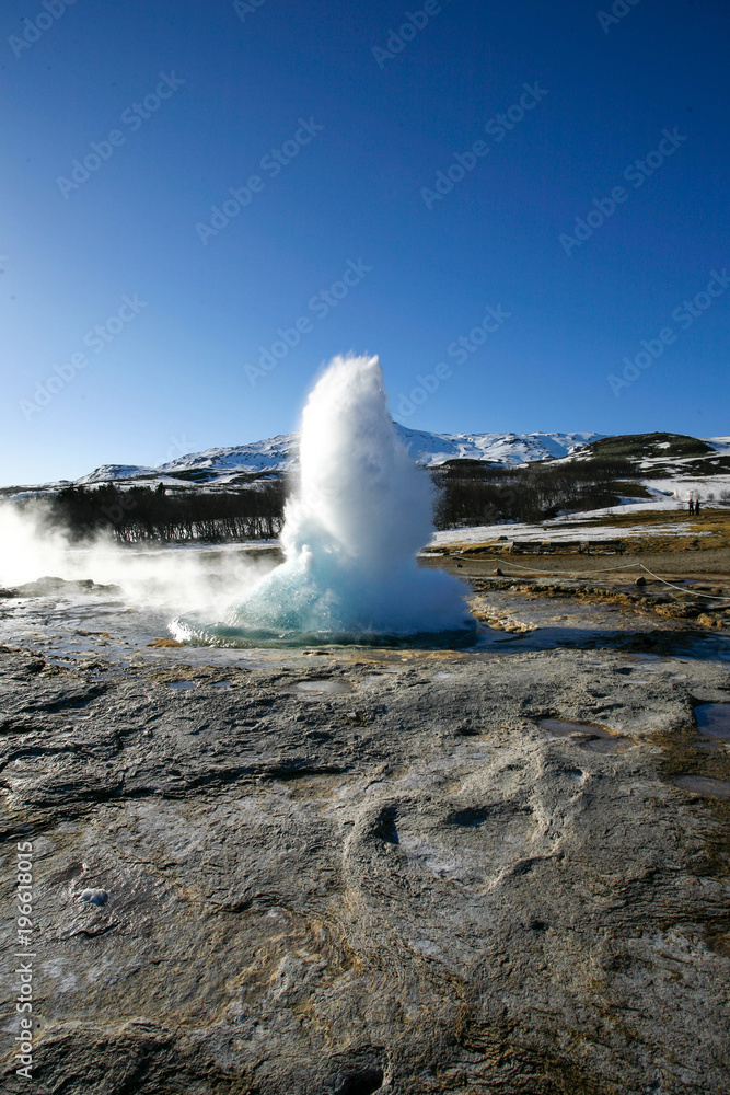 Water geyser in the Island on the blue sky background Water geyser in the Island on the blue sky background