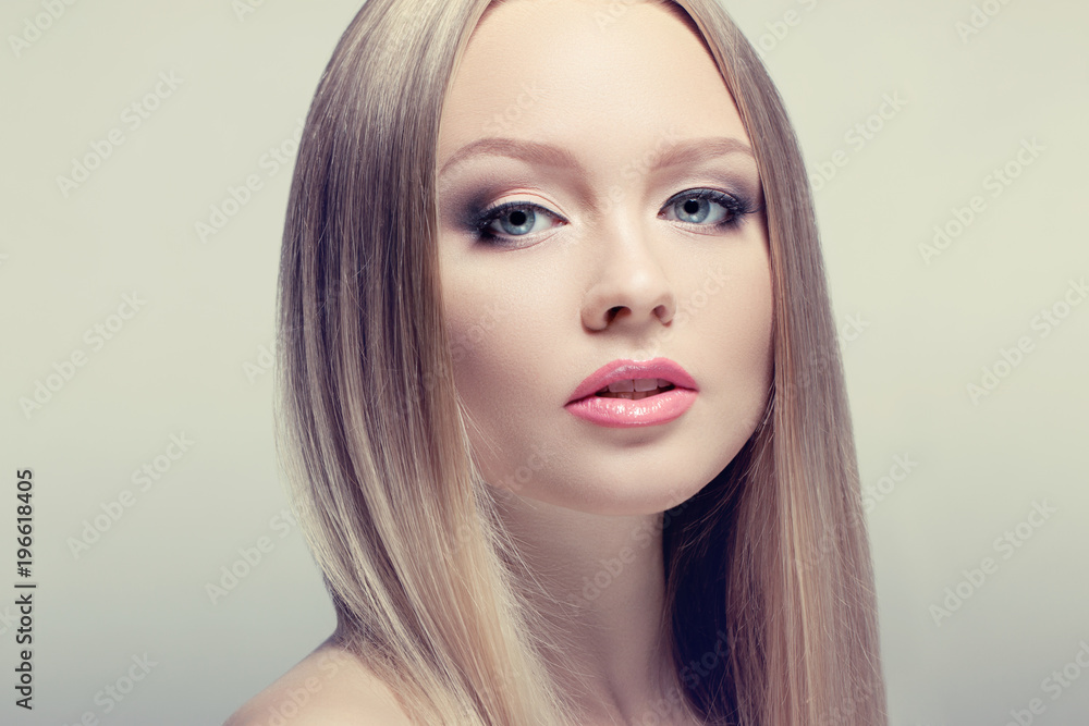 Fototapeta premium Beauty Woman Portrait. Perfect Fresh Skin. healthy well-groomed hair. Youth and Skin Care Concept.