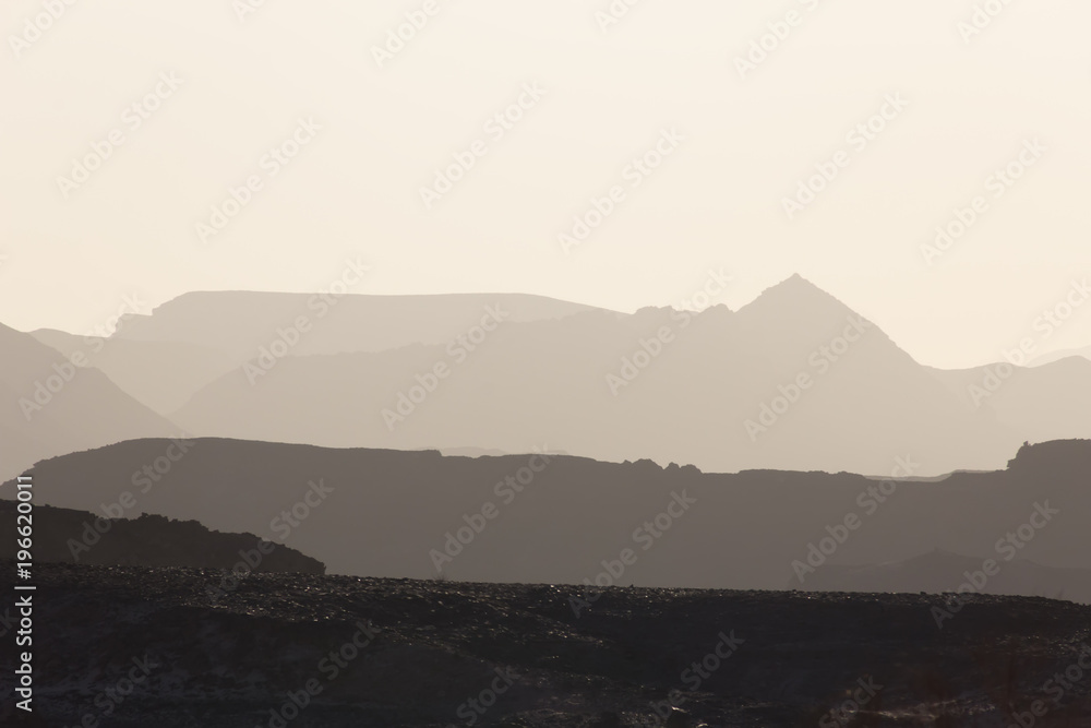 mountain silhouette in the Negev desert in Israel at sunset sunrise mountain silhouette in the Negev desert in Israel at sunset sunrise
