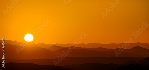 mountain silhouette in the Negev desert in Israel at sunset sunrise © dan
