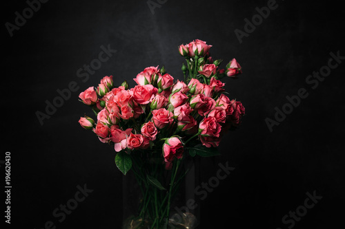 flower Ikibana on a black background, bouquet in a glass vase, ebony, bouquet