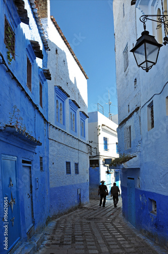 Street with lamp and blue houses in historic Chefchaouen. © Karel