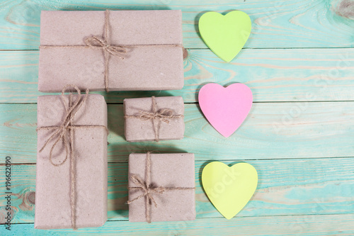 Gift boxes wrapped kraft paper tied with twine and sticker heart and tied with twine. with copy space