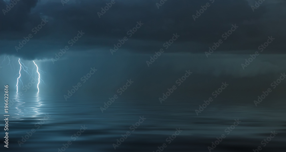 lightning bolts reflection over the sea. taken during a thunderstorm over the ocean with clouds in the background