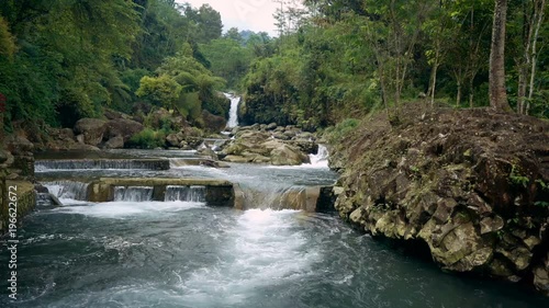 Cascade waterfall on river in Ketenger Tourism Village, Indonesia photo