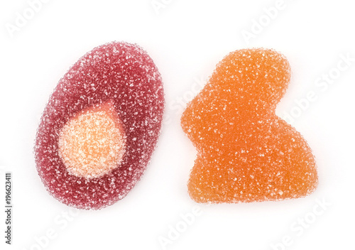Jelly Easter top view isolated on white background two marmalade sweets orange bunny and crimson egg shapes.