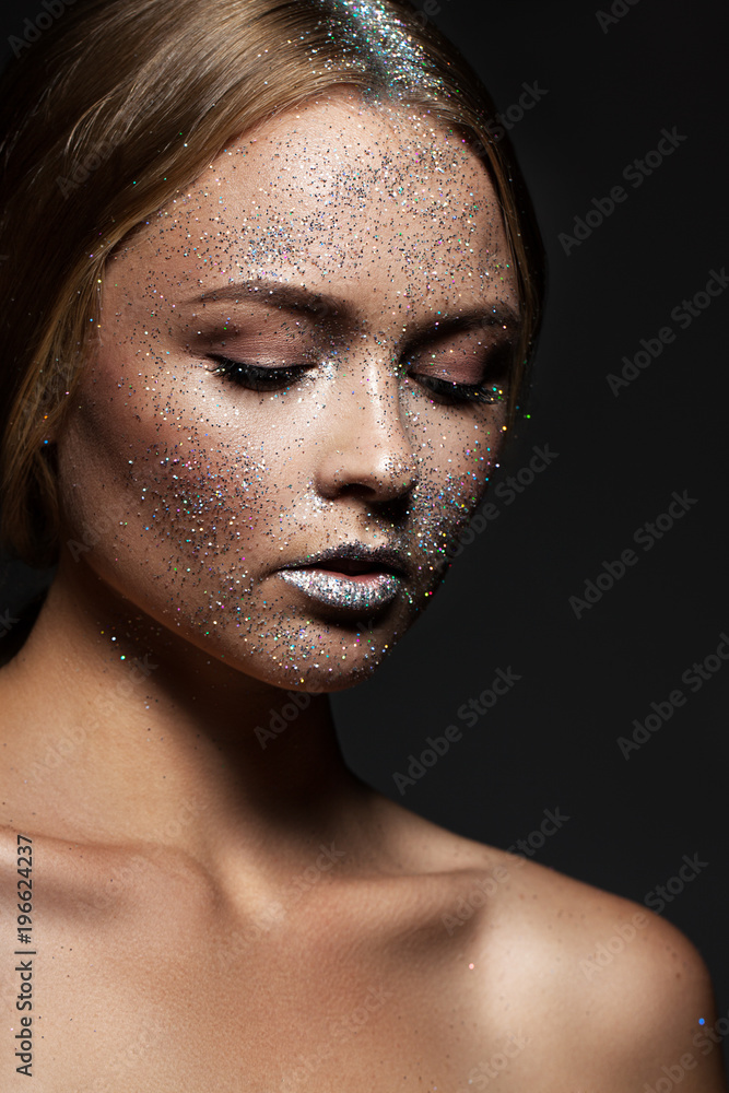fashion beauty glamor girl. Face in Glitter Powder. Close-up portrait of a woman fashion beauty glamor girl. Face in Glitter Powder. Close-up portrait of a woman