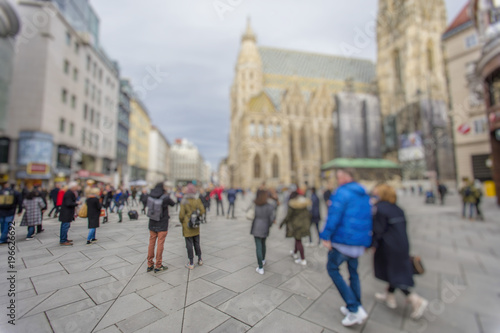 Fototapeta Naklejka Na Ścianę i Meble -  Crowd of anonymous people walking on busy city street