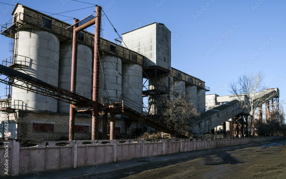 Old factory construction on the background of sky. Old factory construction on the background of sky.