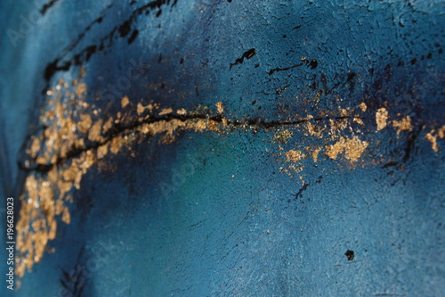 Blue painting acrylic with metal flakes. Drops, lines, arrows close up photo