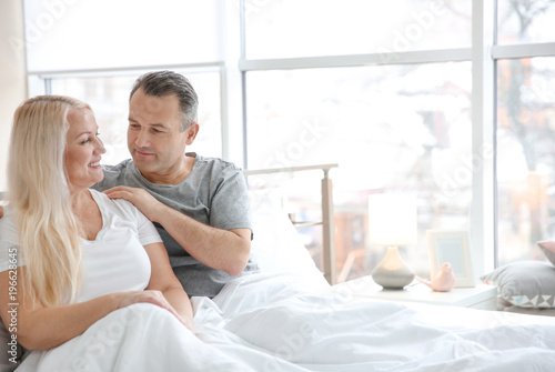 Senior couple in bed togeth...
