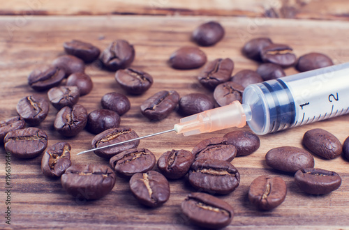 Coffee dependence syringe with beans of coffee