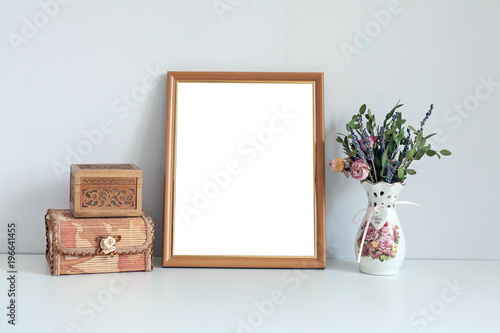 Mockup 8x10 wooden frame with boxes and flowers