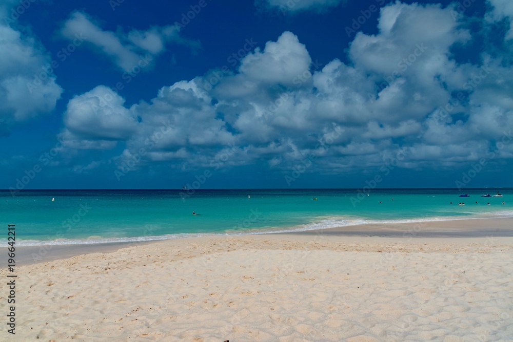 white beach with with sailboats in the ocean in the Caribbean sea Island of Aruba white beach with with sailboats in the ocean in the Caribbean sea Island of Aruba