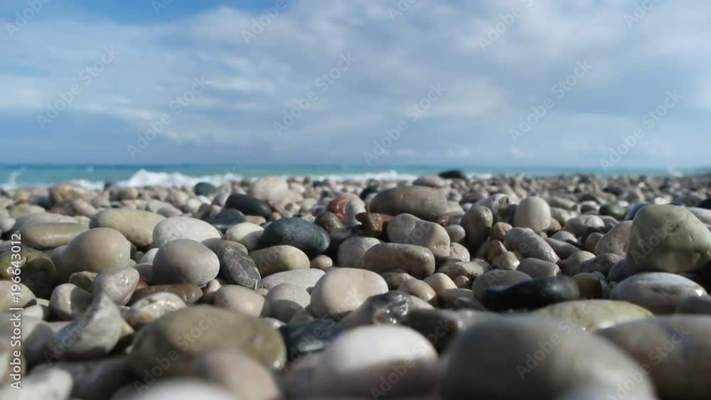 pebbles and sea,slow motion pebbles and sea,slow motion