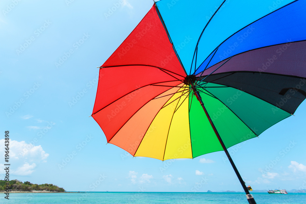 color full umbrella on blue sky