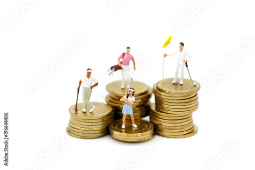 Miniature people : Golfer teams playing stand with stack of coins , sport and business concept.