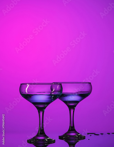 Two wine glasses standing on the table at studio