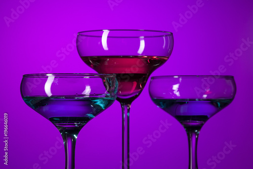 Three wine glasses standing on the table at studio
