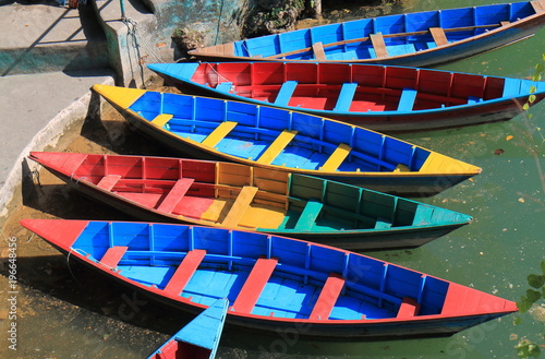 Colourful paddling boat Pokhara Nepal photo