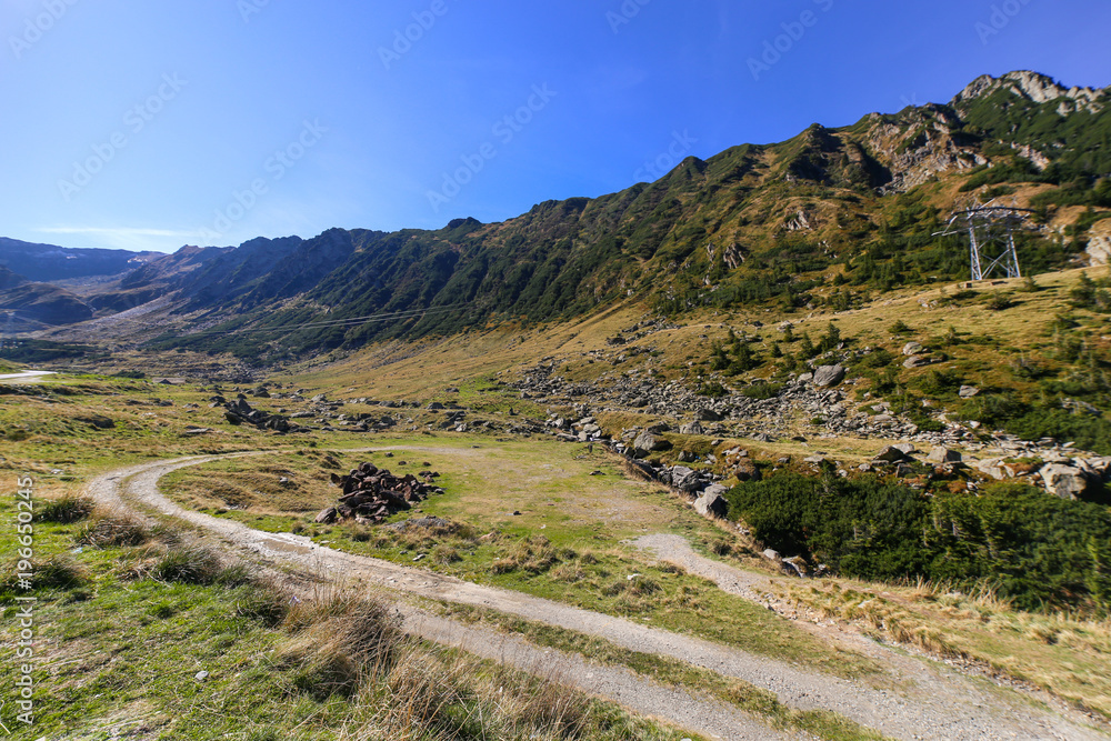 Autumn landscape with Capra river and Fagaras mountains alongside the famous Transfagarasan road in Sibiu county, Romania Autumn landscape with Capra river and Fagaras mountains alongside the famous Transfagarasan road in Sibiu county, Romania