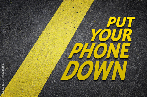 Fotografija Put your phone down road sign concept