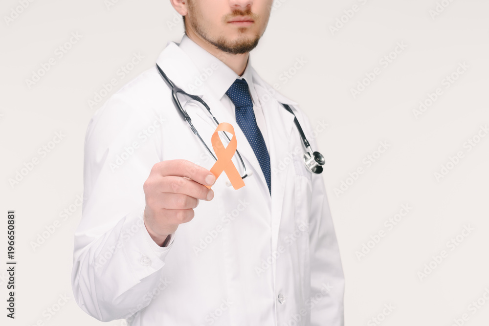 cropped shot of doctor with stethoscope showing orange ribbon isolated on white, world health day concept cropped shot of doctor with stethoscope showing orange ribbon isolated on white, world health day concept
