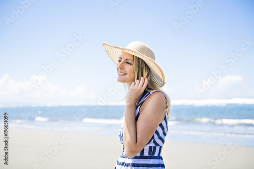 Portrait of a beautiful woman at the beach on day time © Louis-Photo