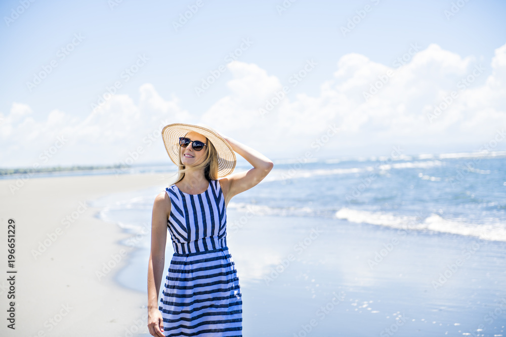 Portrait of a beautiful woman at the beach on day time