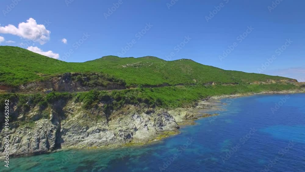 4K Cinematic adventure shot - aerial panorama of an island. Flying along a beautiful coast - crips water and blue sky. Amazing nature drone shot 4K Cinematic adventure shot - aerial panorama of an island. Flying along a beautiful coast - crips water and blue sky. Amazing nature drone shot