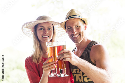 romantic couple drinking beer in a south bar