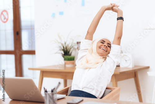 The arab woman in the hijab relaxes.