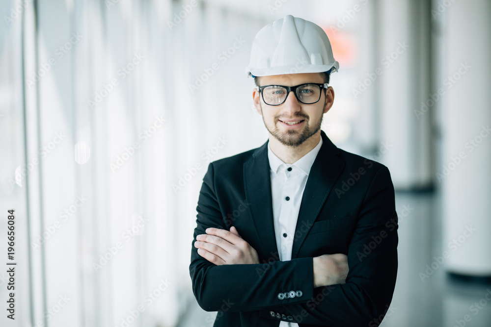 Handsome young technician in control room post arms crossed. Concept Engineer technician Handsome young technician in control room post arms crossed. Concept Engineer technician