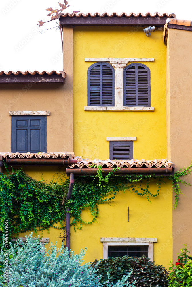 A villa with a creeper on its front wall, Sun Gimignano, Tuscany, Italy, A villa with a creeper on its front wall, Sun Gimignano, Tuscany, Italy,