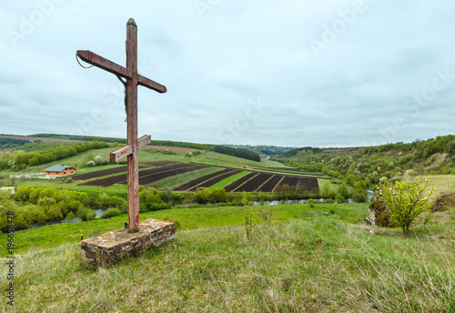 Wooden cross near spring Rukomysh Cave temple, Ternopil Region, Ukraine. photo