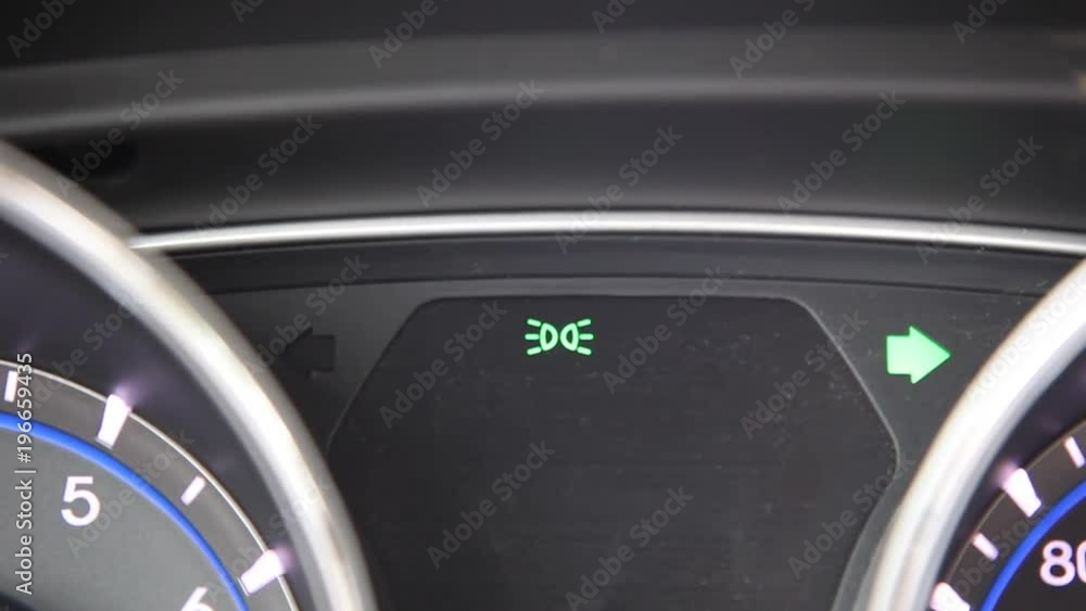 a blinker or turn indicator on the interior of a car green arrow shows right a blinker or turn indicator on the interior of a car green arrow shows right