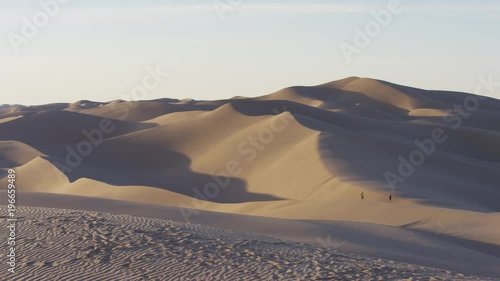 People visiting the sand dunes photo