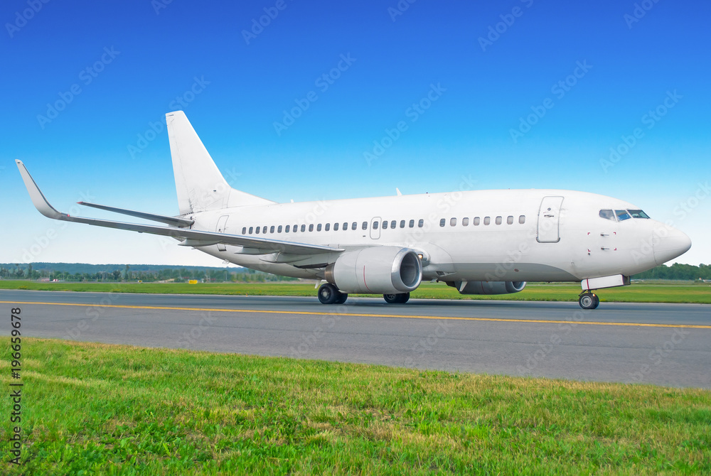 Passenger airplane taxiing to the runway at the airport. Passenger airplane taxiing to the runway at the airport.