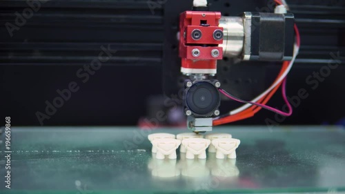 3D printer prints parts multiple shape objects photo