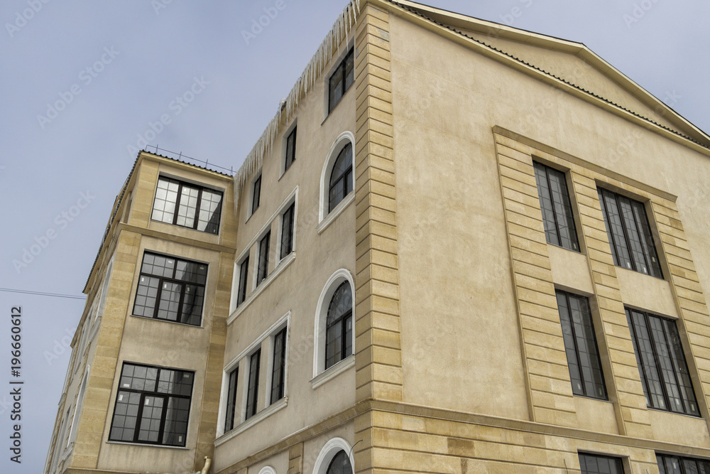 Modern building built in antique style. Modern architecture. New commercial building. Edifice. New building built in the old style. Building under construction Modern building built in antique style. Modern architecture. New commercial building. Edifice. New building built in the old style. Building under construction