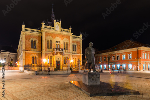 Novi Sad, Serbia March 14, 2018: Center of Novi Sad in Zmaj Jovina street with Vladicin court residential palace and monument of Jovan Jovanovic Zmaj.