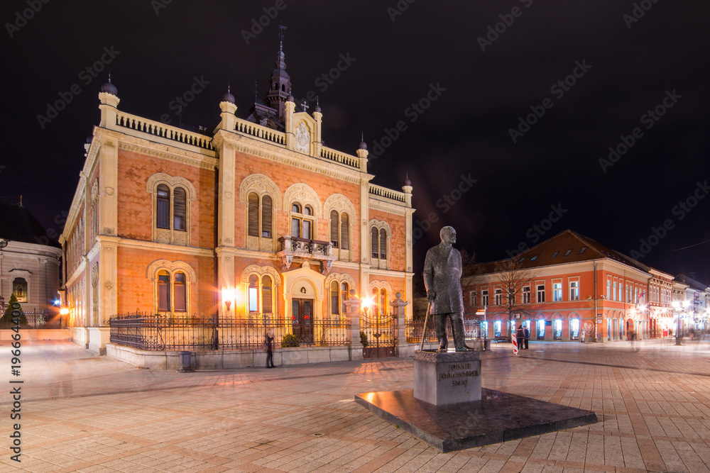 Novi Sad, Serbia March 14, 2018: Center of Novi Sad in Zmaj Jovina street with Vladicin court residential palace and monument of Jovan Jovanovic Zmaj.