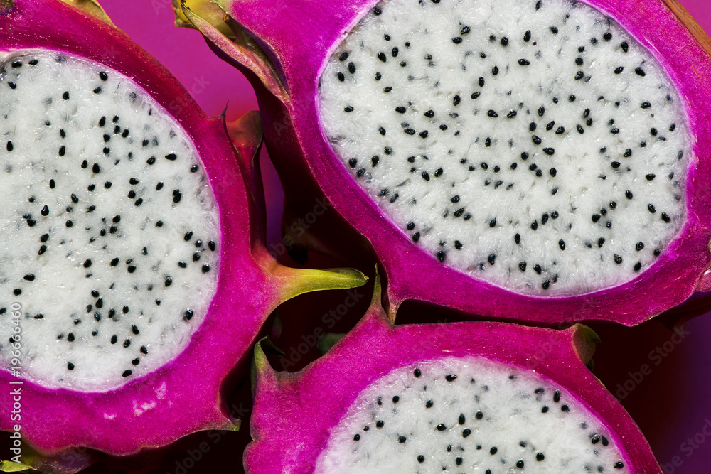 Longitudinal section of a ripe dragon fruit Longitudinal section of a ripe dragon fruit
